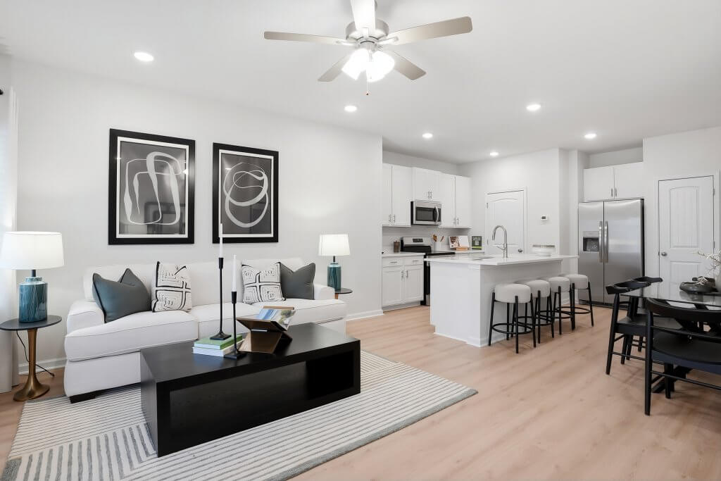 Modern townhome floor plan in Fayetteville: Open-concept kitchen and living room with contemporary finishes and bright, airy interiors.